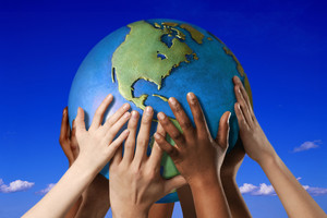 Student hands holding a globe or model of the earth