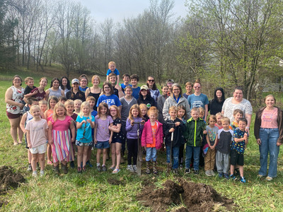 A class of kindergarten students after planting their trees.